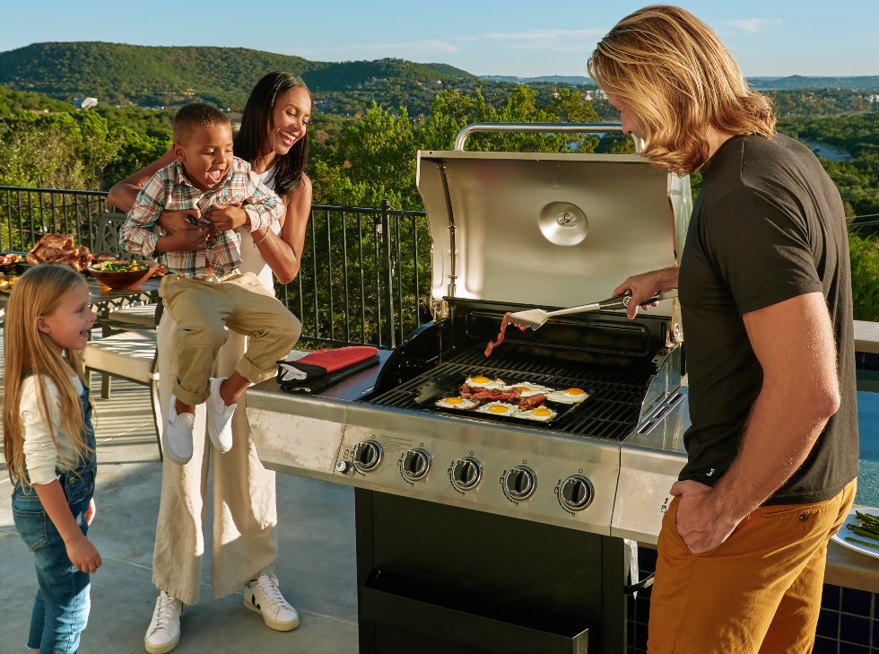 Oscarware® Porcelain Coated Griddle Topper grilling bacon and eggs